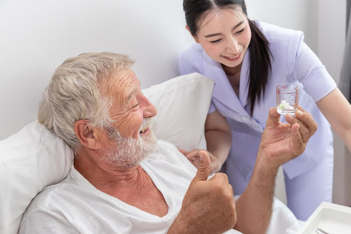 Helper helping elderly with daily tasks